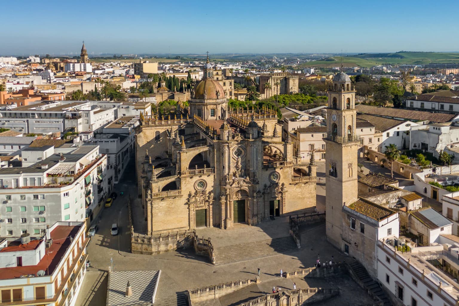 Aerial view of Jerez de la Frontera Cathedral and bell tower rising above the white-washed rooftops of the Andalusian city.